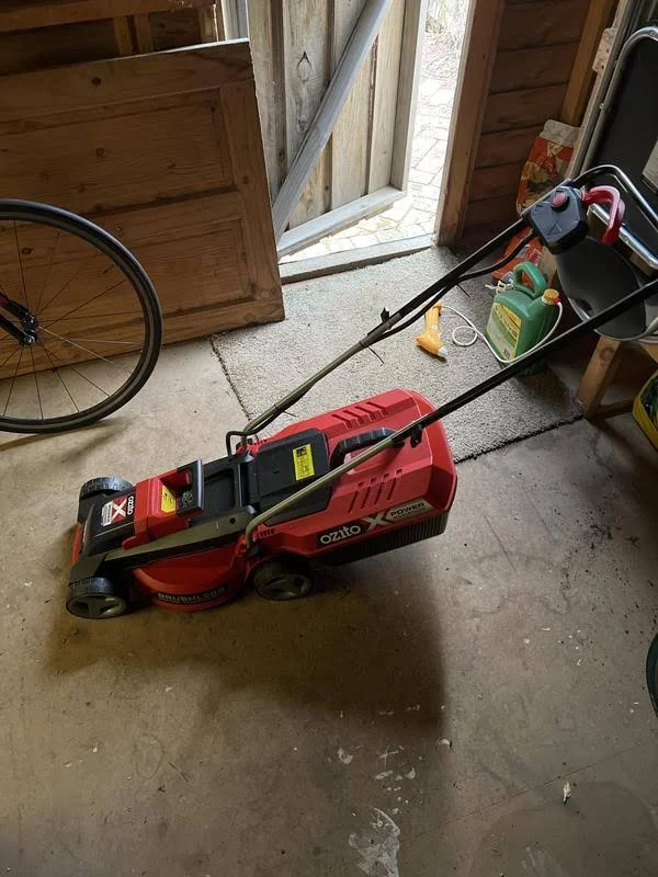 view of our own purchase testing ozito pxc 18v brushless kit budget lawn mower australia unboxing package arrival several weeks to months